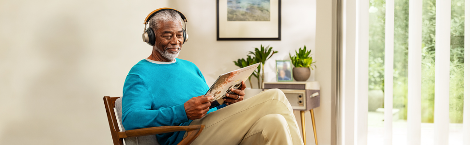 Man sitting in a chair reading